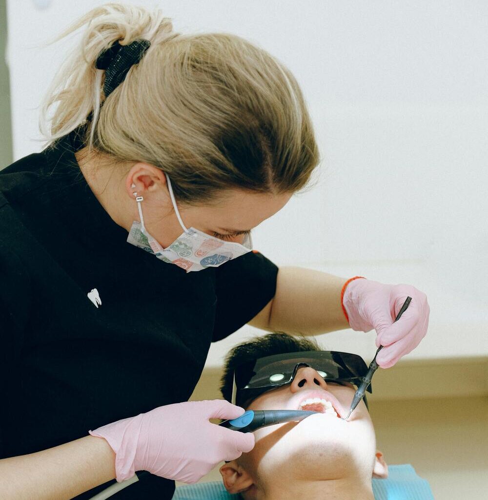 mild tooth pain — patient consulting dentist about root canal symptoms in Miami