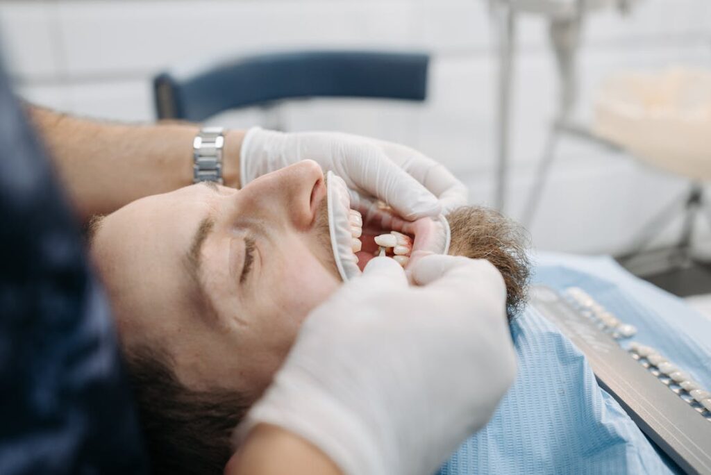 dental crown cost in Miami — dentist examining patient
