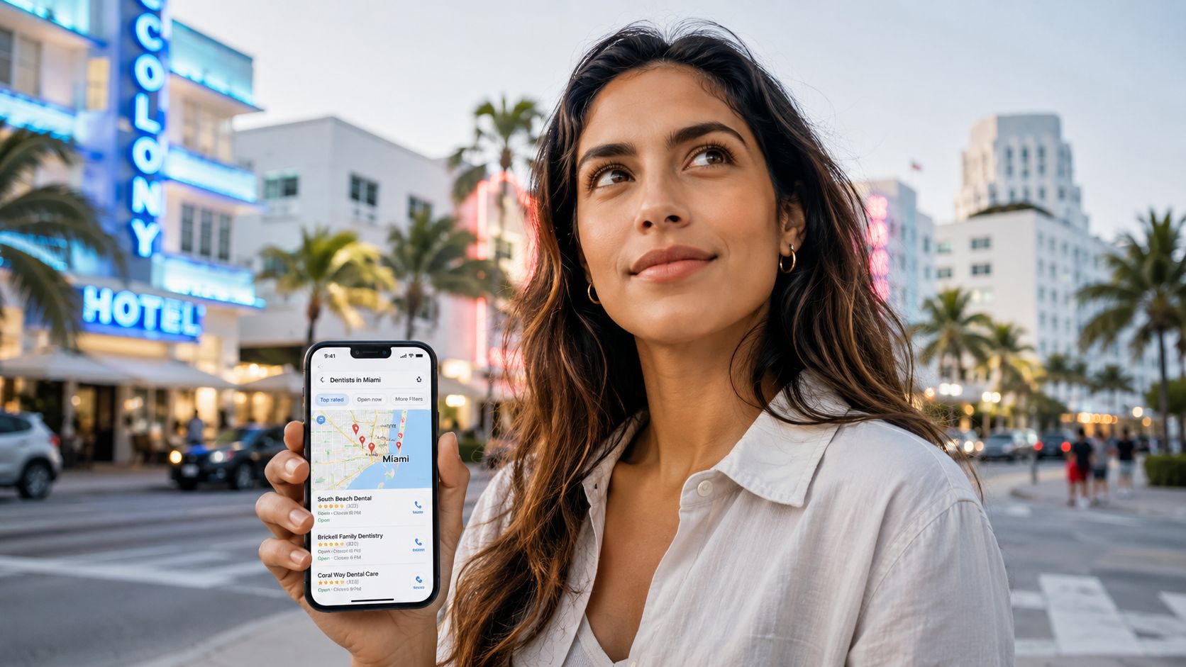 A woman holding a smartphone displaying a map of dental offices in Miami on a city street.