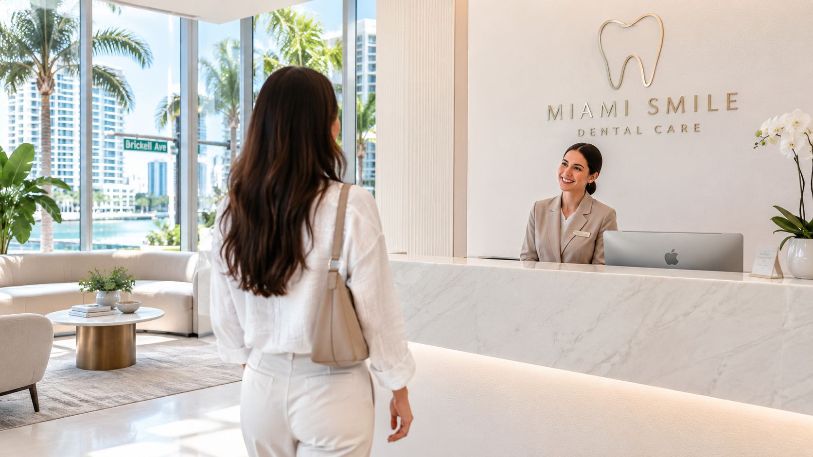 A smiling patient approaches a receptionist at the modern, professional front desk of Miami Smile Dental Care.